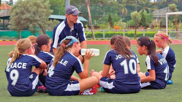 Coach Neil Prendergast gives encouragement during half time