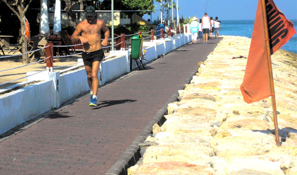 Out for morning exercise on Kuta's new breakwater