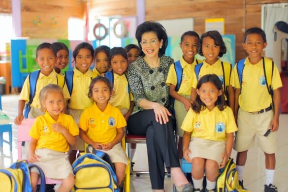 Indri Gautama and school kids