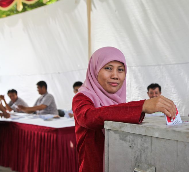 A woman casting her vote on July 9