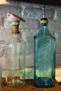 Re-used glass bottles engraved by local artisans make great gifts.