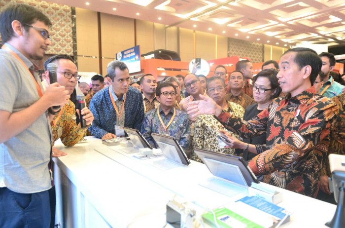 President Joko 'Jokowi' Widodo attends a fintech festival in Indonesia. Fintech startups, particularly P2P lending firms, are now required at least $260,000 capital, according to new regulations. 