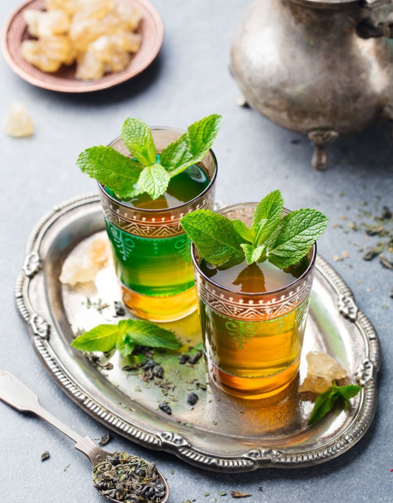 Mint tea, Moroccan traditional drink in glass. Close up.