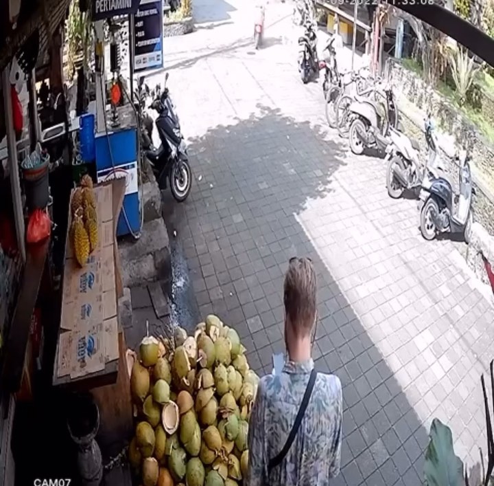 Pushing Local Motorcyclist
