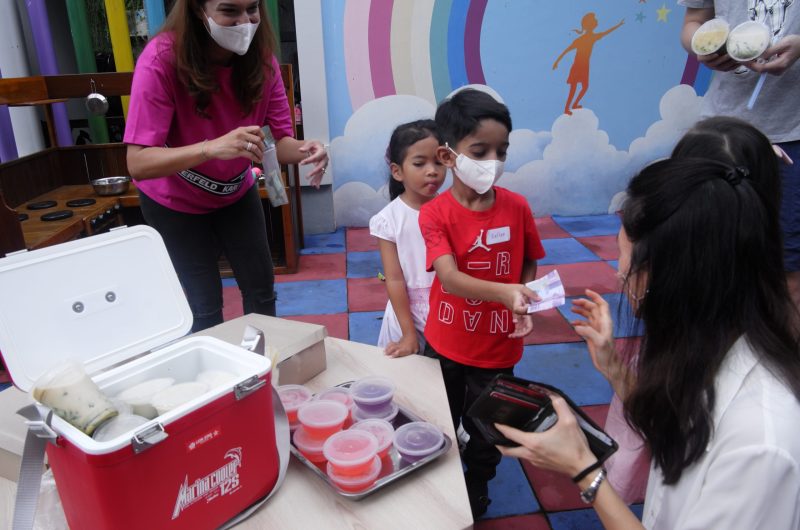 Aerokids Pre-School students selling their crafts to parents