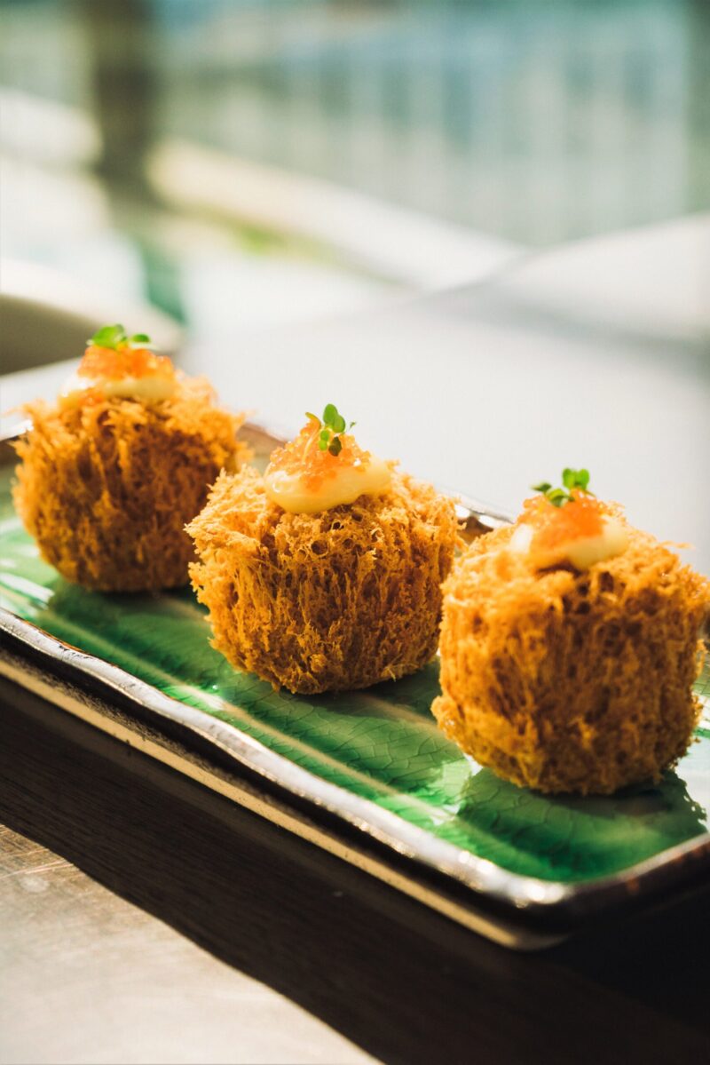 Crispy salted egg puff with scallops, mayonnaise and tobiko