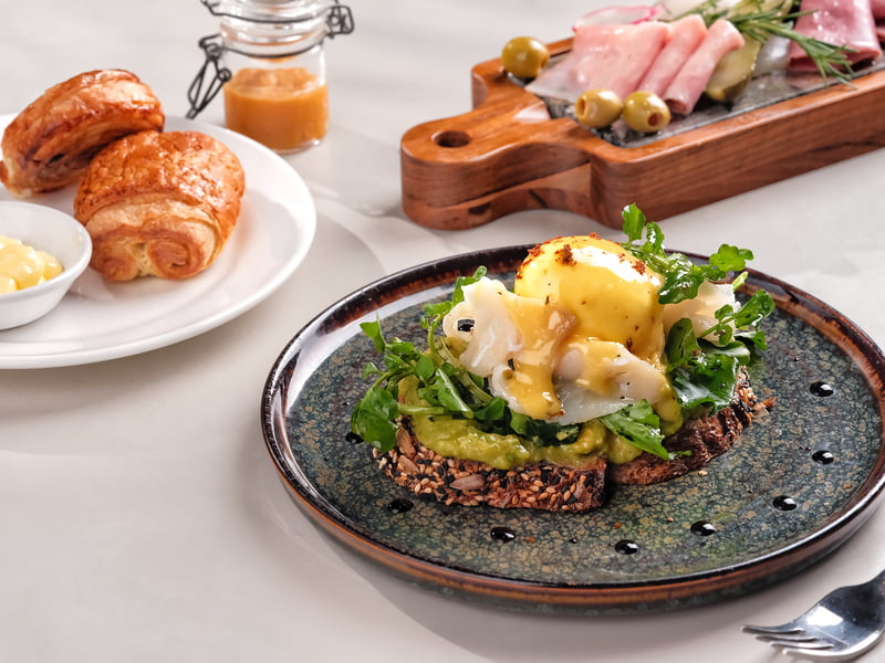 Avocado Toast & Eggs Benedict by ROOMAH Canggu